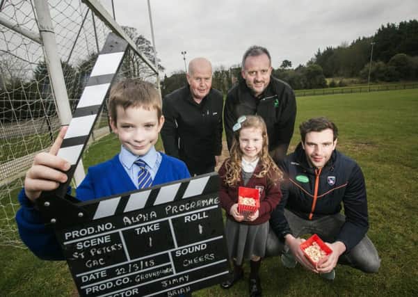 Local kids David Pietrzkieicz and Sophia McEvoy pictured with (back L to R) Jimmy Magee, St Peters GAC, Richard Rogers, The Alpha Programme and Aaron Findon, Armagh GAA midfielder at the clubs grounds in Lurgan. St Peters GAC has been awarded Â£50k through the Alpha Programme to build a new spectator stand. The new look club will attract larger sporting events and hold film screenings and concerts one work is complete.