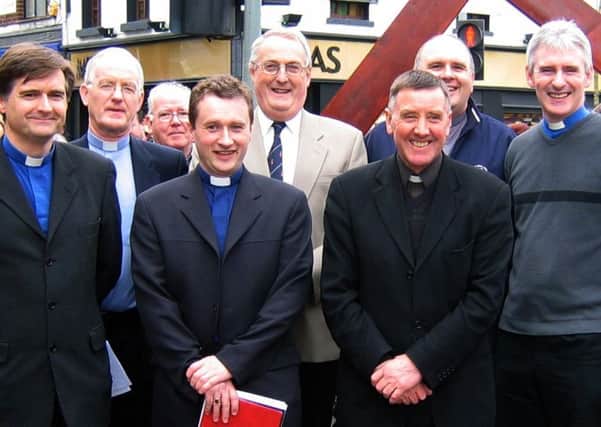 Clergy from Lisburn City Centre Ministers Fellowship pictured taking part in the first Good Friday Walk of Witness in Lisburn in 2005.  L to R:  Rev John Brackenridge (First Lisburn Presbyterian), Rev Brian Gibson (Railway Street Presbyterian), Rev Paul Dundas (Christ Church Parish), Pastor George Hilary (Lisburn Christian Fellowship), Father Sean Rogan (St Patricks Roman Catholic Church), Rev Brian Anderson (Seymour Street Methodist) and Rev Sam Wright (Lisburn Cathedral).