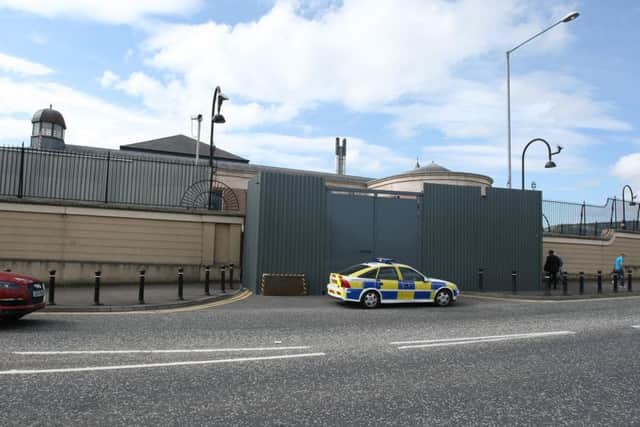A man has been charged with a car bomb attack on Newry courthouse on 22 February.
The 51-year-old was arrested by detectives from the Serious Crime Branch in the Dunmurry area on Monday.
He is due to appear at Newry Magistrates Court on Wednesday morning.
No-one was killed or injured in the attack but the explosion did cause damage to the gates of the courthouse. It was the first time a large car bomb had exploded in NI for 10 years.