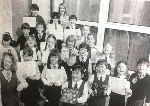Pupils of Portadown teacher Miss Jill McQuade with prizes they won at the Portadown Speech Festival in 1988.