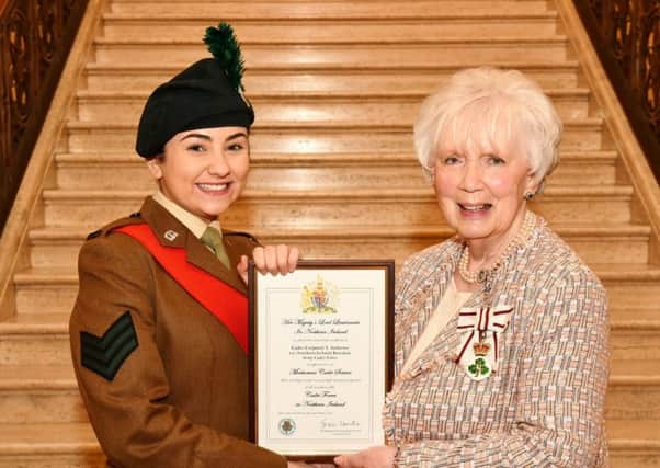 Yasmin receiving the certificate which marks her appointment from Mrs Joan Christie CVO OBE, Her Majestys Lord Lieutenant for County Antrim.