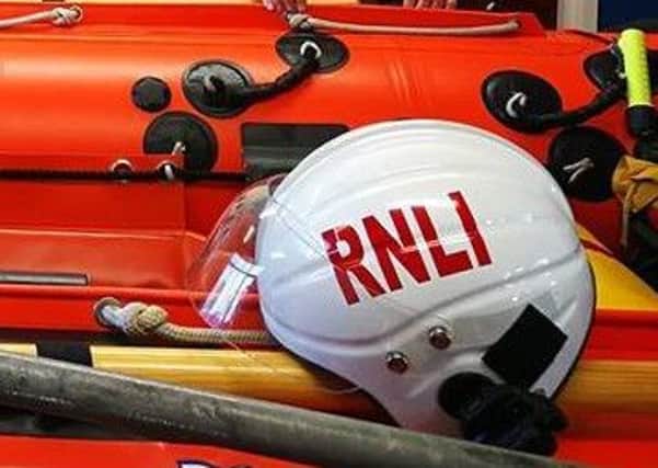 An RNLI lifeguard came to the teens' rescue