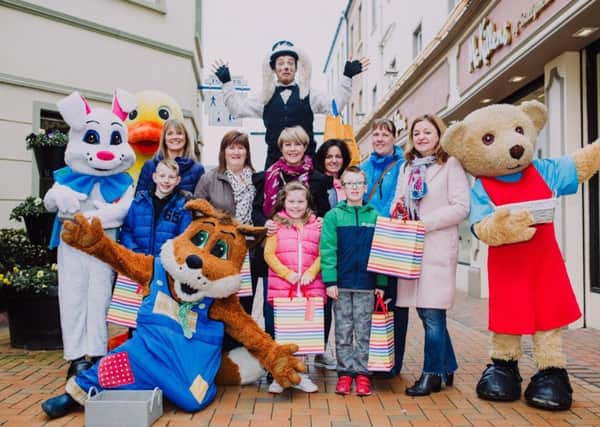 Winners of the Ballymena BID Easter competition receive their prize from BID Manager, Alison Moore. Pictured with the Friendly Faces Characters and the Spring Hare are (L-R) Karen McClintock and son Ruben, Hazel Coates, Olive McIllwaine and daughter Katie, BID Manager Alison Moore, Jesse McNeilly and mum Christina and Aurelia Kelly.