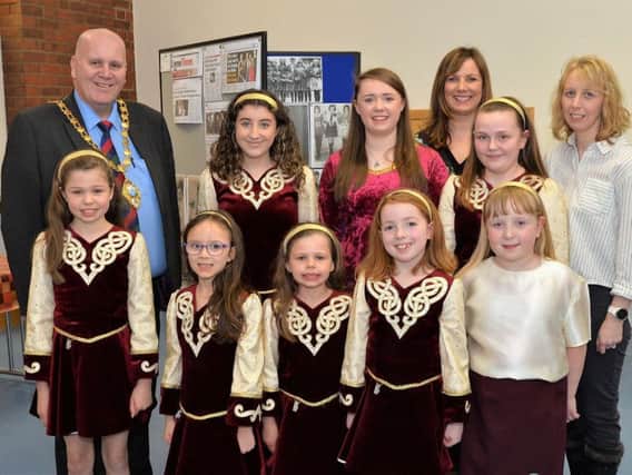 Mayor of Mid and East Antrim Borough Council, Councillor Paul Reid is pictured with members of the Lisa Dempsey School of Irish Dancing, Angeline King and Lisa Dinsmore at the launch of a new exhibition celebrating 90 years of Irish dancing in Larne. INLT 14-001-PSB