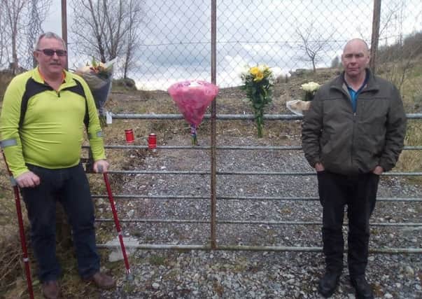 Laying flowers at the scene where Marian Beattie was found murdered 45 years ago