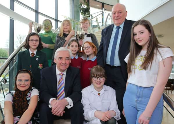 Alderman Tommy Jeffers, Chairman of the council's Environmental Services Committee, and TV presenter Paul Clarke are pictured with the top three winners in the Junior and Senior sections of the Environmental Youth Speak competition. Pic by Philip Magowan