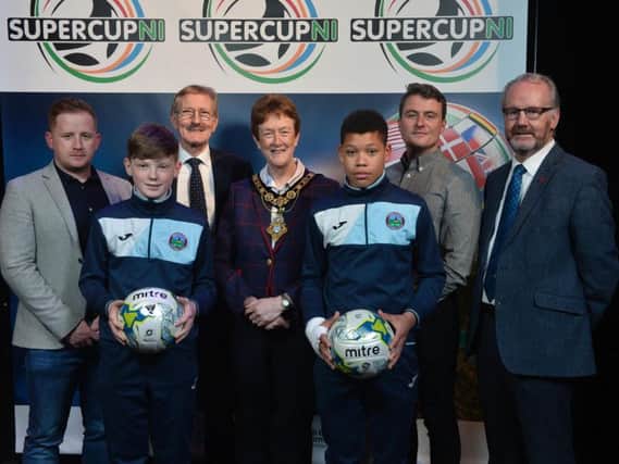 SuperCup NI Chairman, Victor Leonard, Joan Baird OBE, Mayor of Causeway Coast and Glens Borough Council and councillor Billy Henry, Mid and East Antrim Borough Council, pictured with Greenisland U13 manager Niall McGovern, coach Marc Gamble and players Jack Patterson and Reece Black.
