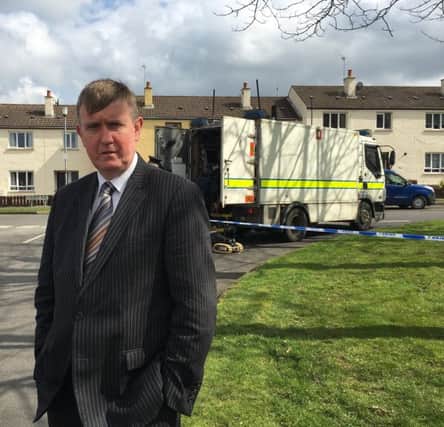 North Antrim DUP MLA Mervyn Storey pictured at the scene in Ballymoney.