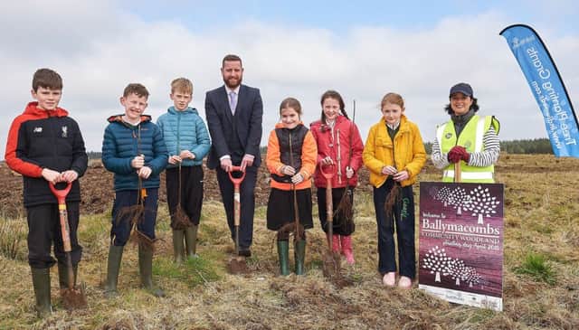 Students from St. Marys P.S. Bellaghy are pictured during a tree planting with Chair of the Councils Environment Committee, Councillor Ronan McGinley and Carolyn Trimble from IndiWoods.