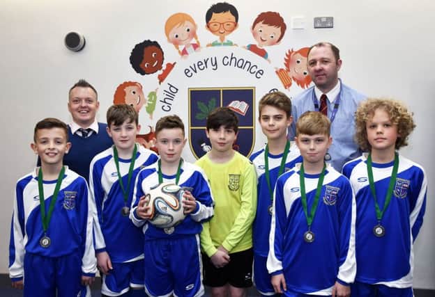 The Ebrington Primary School team who were runner-up in the Northern Ireland Futsal finals in Belfast. Included are Johnny Moore, teacher, and Gary McClements, assistant coach. DER1618-101KM