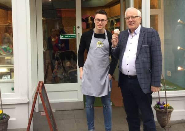 Alderman Allan Ewart MBE (right), Chairman of the council's Development Committee, with Thomas Taylor at his family's new store on Bow Street, Lisburn.