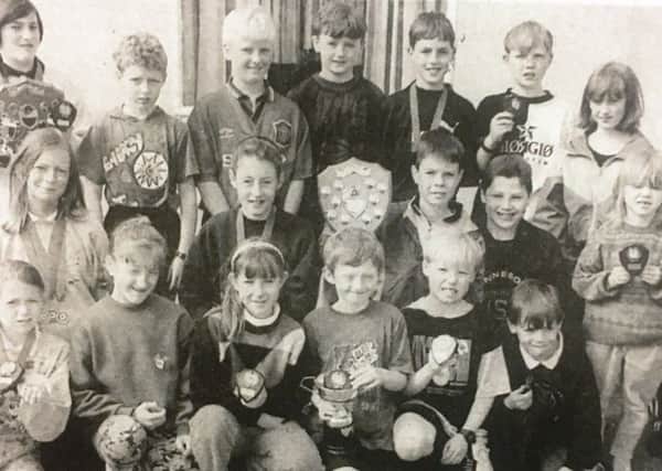 Prizewinners at Tullymacarette Primary School sports day in 1995.