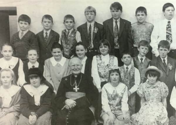 Pupils from St Ciaran's Primary School Ballygawley with Cardinal Cathal Daly following confirmation ceremonies in 1994.