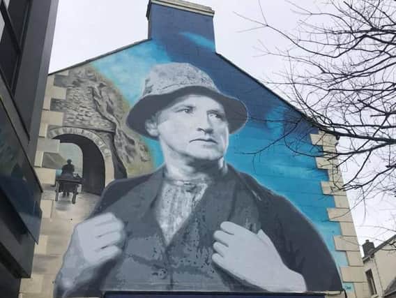 Main Street mural of actor, film-maker, musician and writer Richard Hayward.