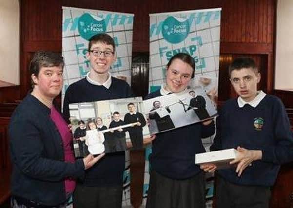 Pupils from Hill Croft School received a new iPad from Naomi Thompson, Cancer Focus NI.