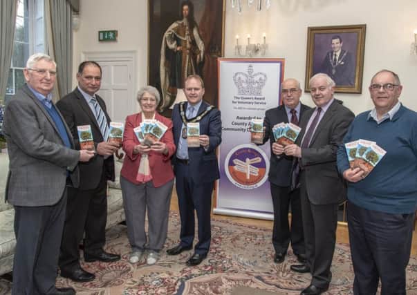 At the launch of the tourism brochure are (from left) William McClean, Carleton Street Orange Hall; Geoffrey Winter and Hilda Winter, Dan Winters Cottage; Lord Mayor Alderman Gareth Wilson; Denis Watson and Roger Gardiner, Sloans House; and Trevor Geary, Dan Winters Cottage