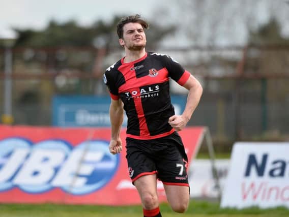 Crusaders midfielder Philip Lowry celebrates scoring their equaliser at the Ballymena Showgrounds.