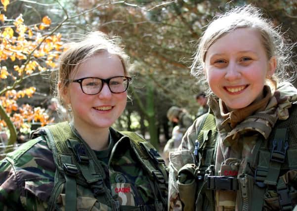 Cambridge House Cadets, 14-year-olds Lucy Millar (left) and Naomi Nevin, take a hard-earned break and enjoy the sunshine at Spring Cadet Camp.
