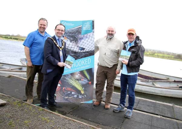Mayor of Antrim, Councillor Paul Hamill launches the new Angling Guide at Straid Fishery with Ray McKeeman (Straid Fishery Manager), Harry McAteer (Secretary of Straid Fly Fishers) and Stevie Munn (Professional Fishing Guide).
