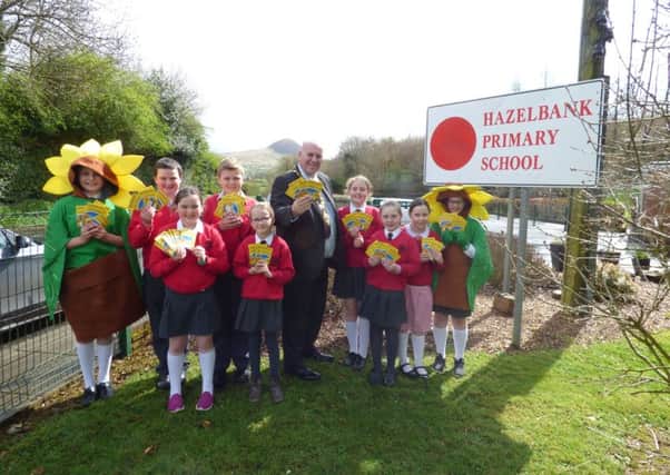 Mayor of Mid and East Antrim Paul Reid delivering sunflower seeds to pupils at Hazelbank PS, as well as other schools across the borough.