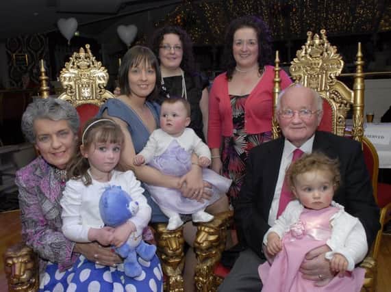 Ernie Hamilton and wife Mary, picture with their daughters, Heather, Miriam and Eleanor and granddaughters, Annie, Sophie and Victoria, at the surprise party held in the Belfray Country Inn to celebrate her 70th birthday in 2011.