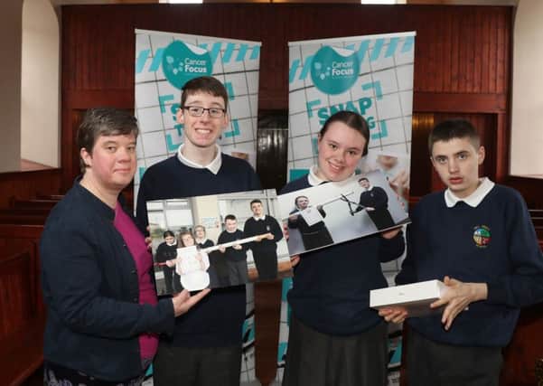 Naomi Thompson from Cancer Focus NI presents pupils from Hillcroft Primary with the new iPad their schools entry won in the Snap the Cig photo competition.
The aim of the competition was to encourage as many children as possible to take part in the campaign for a smokefree future. Entrants were asked to snap a photo on the themes of smokefree cars, smokefree grounds or stopping smoking.
Photograph by Declan Roughan