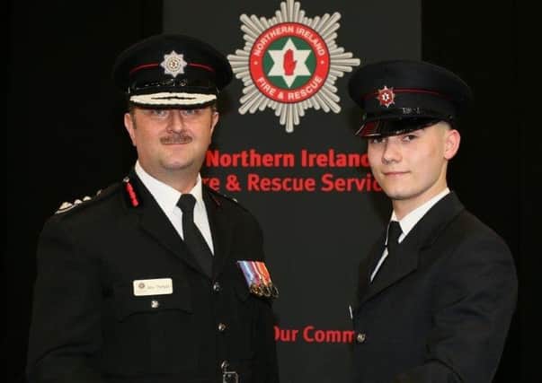 Firefighter Jamie Dayer from Moira with Chief Fire & Rescue Officer Gary Thompson.