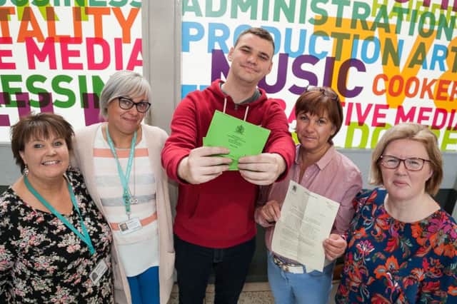 Ross McMullan has the Royal Wedding Invitations while his mother holds his letter from the Lord Lieutenant. Included are NRC Lifeskills Tutor Oonagh Hughes, Learning Support Worker Samantha Dobbin, and Lifeskills Co-ordinator Sharon Connolly.