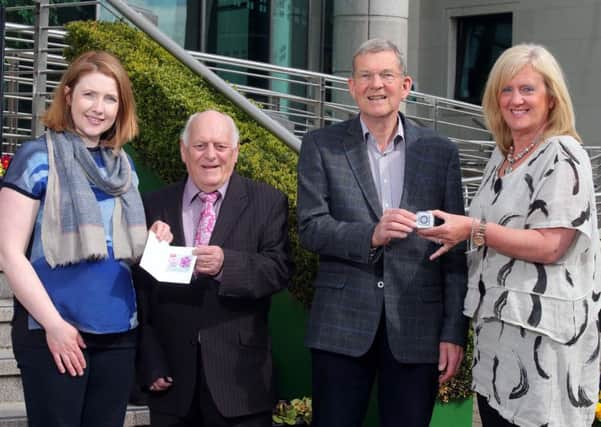 Recycling and waste survey winners Naomi McLaughlin and Eric Patterson recieve their prizes from Alderman Tommy Jeffers, Chairman of the council's Environmental Services Commitee and Heather Moore, Director of Environmental Services.