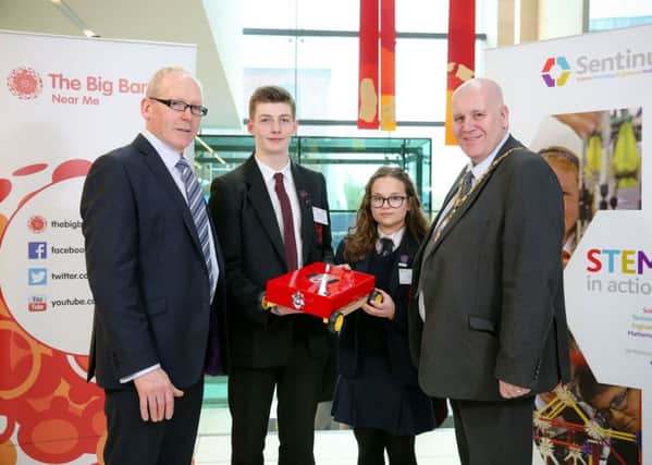 Pictured at the recent Sentinus Big Bang exhibition at the Braid is Bill Connor, Sentinus CEO and Mayor of Mid and East Antrim Paul Reid with Ballymena Academy pupils Timothy Day and Anisia Tiplea. Their project, in partnership with Wrightbus, involved the design of an automated guided vehicle.
Picture: Philip Magowan / PressEye