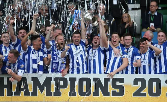 Coleraine lift the  Tennents Irish Cup Final at the National Football Stadium at Windsor Park. Picture by Brian Little