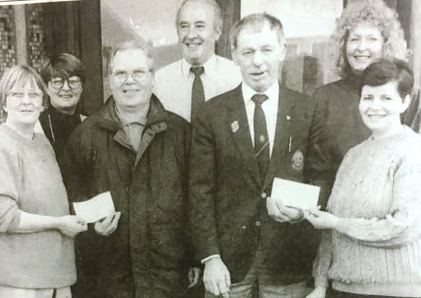 Pictured in 1981 Virginia McCluskey and Kathleen McKeever present cheques from employees at Saracen, Lurgan to Denis Cassidey of St Vincent de Paul and Joe Kerr of Lurgan Lions Club.Also included are Laura Houston, Hugh Leathem, and Sylvia Watson.