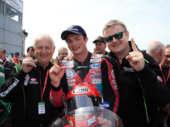 James Cowton celebrates his Supertwin victory with Winston (left) and Jason McAdoo.