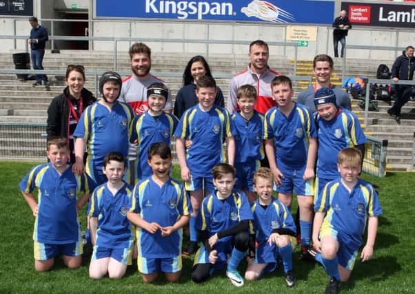 The Mossley Primary School pupils who took part in the  Ulster Primary Schools Mini Rugby Festival at the Kinspan Stadium with Ulster players John Andrew and Tommy Bowe also Ciara Dunne Marketing Executive with Maxol. Picture by Freddie Parkinson/Press Eye Â©