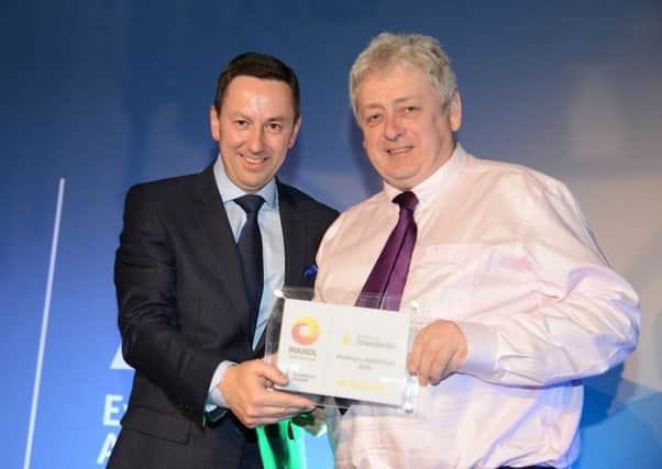 Tom McAvoy (right) from McAvoys Maxol Service Station, Rathfriland receives the 'Excellence in Standards' award from Brian Donaldson, CEO of the Maxol Group.