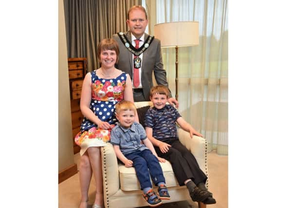 Alderman Gareth Wilson with his wife Allison and their sons Lewis and Micah.