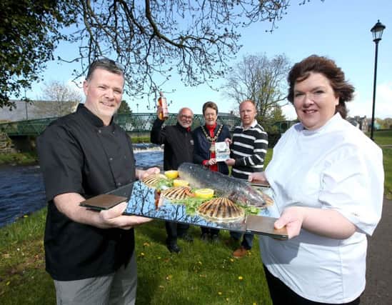 ary Stewart and Paula McIntyre pictured with Niall Mehaffey from Bushmills Distillery, the Mayor of Causeway Coast and Glens Borough Council Councillor Joan Baird, OBE and Tim Delargy from Department of Environment, Agriculture and Rural Affairs at the launch of Bushmills Salmon and Whiskey Festival which takes place on June 9 and 10.
