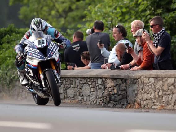 Michael Dunlop on the Tyco BMW at Sulby Bridge.