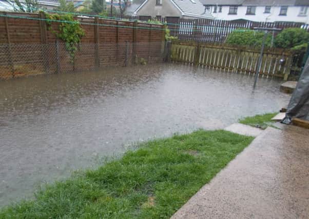 Water flooded Mr Moore's garden.