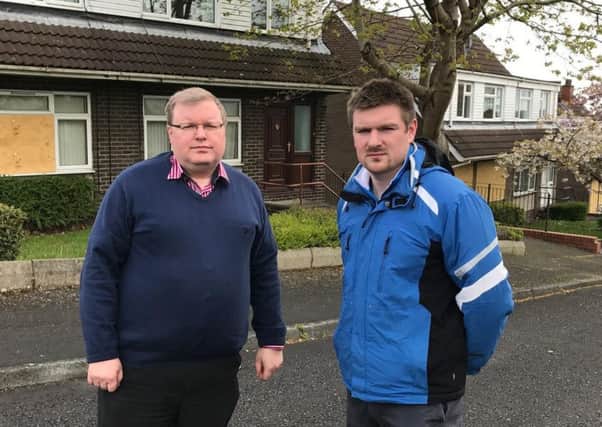 DUP councillors Jonathan Craig and Scott Carson want to see the former MoD houses refurbished as soon as possible