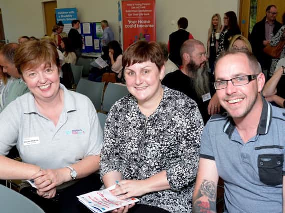 L-R Marica Mc Bride (Family Placement Team) with Danielle and Steven Matthews from Loughgall at the Trust's Information Evening. (submitted picture).