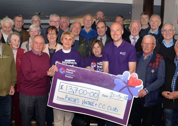 The Birches Vintage Vehicle and Classic Car Club have raised Â£13,700 for the Northern Ireland Children's Hospice through their annual Big Country Night at the Seagoe Hotel. Pictured at the presentation of the cheque are club members and hospice volunteers. Included in the presentation party are from second left, John Wilson, chairman, Irene Maitland and Viven Jess, chairs of hospice support groups, Johnny Breen, Regional fundraser, andWilliam Henderson, club treasurer. INPT21-212.