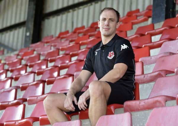 STAYING PUT . . .Mark McChrystal has agreed a new deal with Irish League champions, Crusaders.