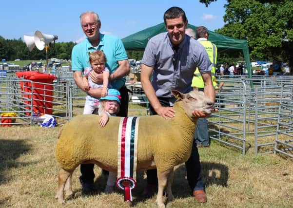 The Bell family, from Comber in Co Down, celebrate their winning of the Inter-Breed Sheep Championship at Armagh Show 2018