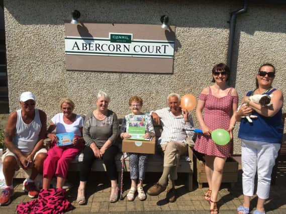 Residents of Abercorn Court pictured enjoying the beautiful weather, joined by Eden Project communities NI manager, GrÃ¡inne McCloskey and Scheme Co-Ordinator Fiona Milnes.