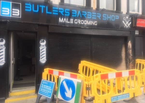 Butler's Barber Shop at Market Place was damaged in the early morning arson attack.
