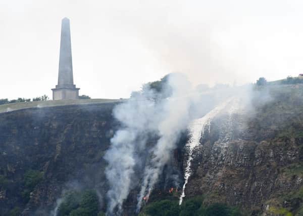 Firefighters tackle a gorse fire beside the Knockagh Monument near Carrickfergus on Monday. Pic by Colm Lenaghan/Pacemaker