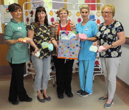 Pictured are Jean Taylor, Phyllis McLoughlin and Donna Dawson of Knit and Natter Knitting Group in Limavady Library who made the presentation to Neonatal Unit staff Lorraine Coyle and Muriel Buchanan.