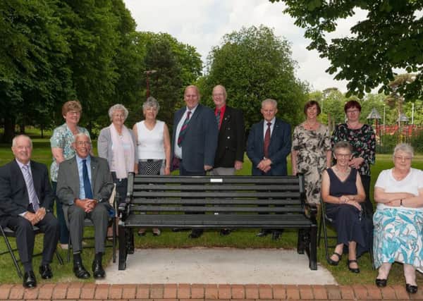 Councillor Paul Reid (fourth from left) and former Ballymena councillor Maurice Mills MBE (third from right) and guests at the unveiling of the new memorial benches at the People's Park, donated by the Ballymena Victims' Memorial Group.