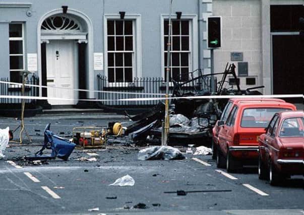 The scene of devastation at Market Place, Lisburn in June 1988 after an IRA bomb exploded under an Army transit van killing six soldiers. Pic by Pacemaker